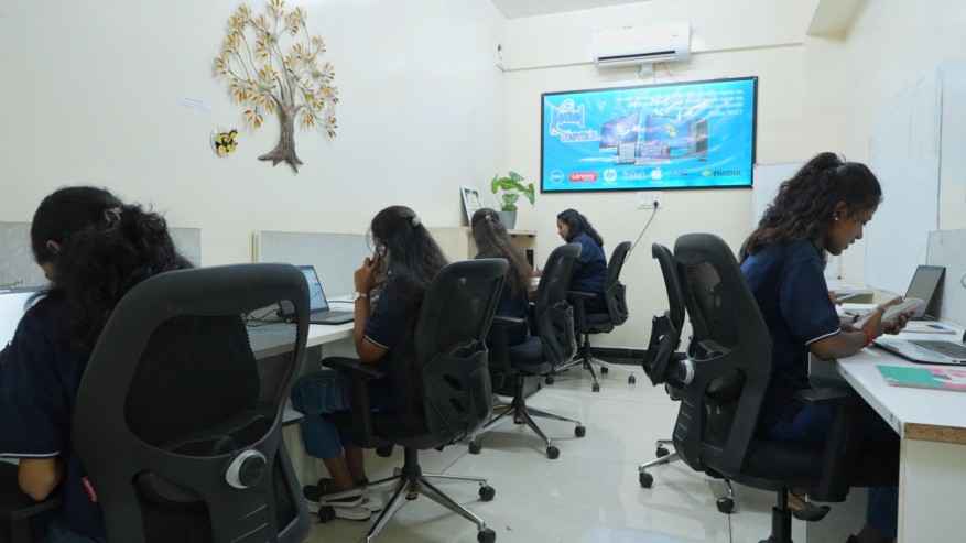 Bethel Computech team members working in a modern office and customer support workspace.