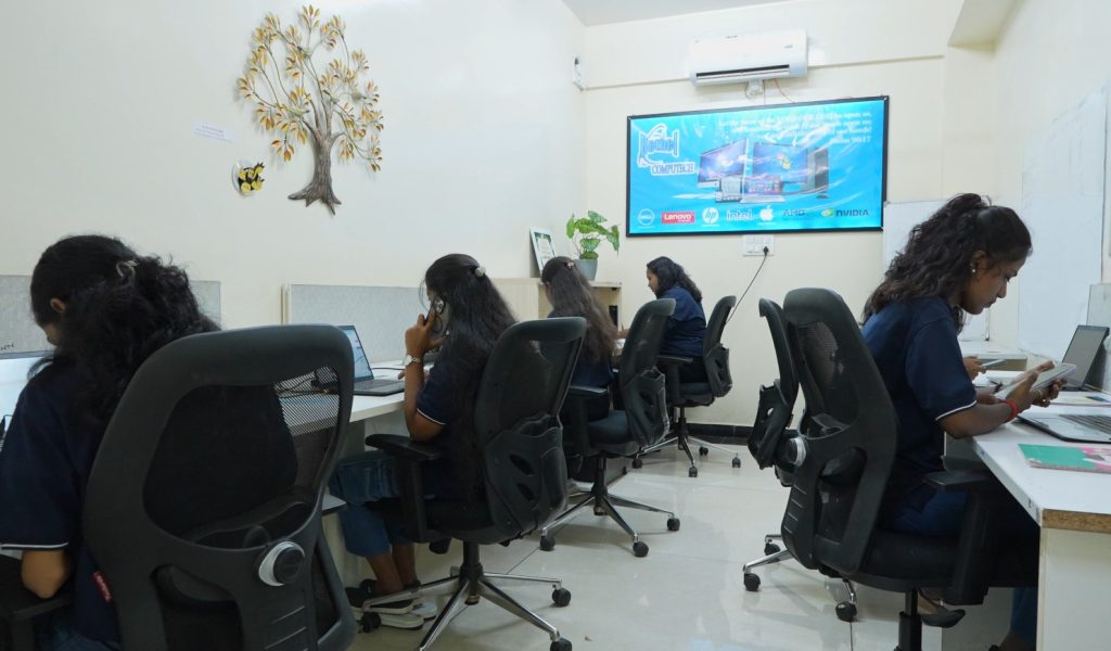Bethel Computech customer support and operations team working in a collaborative office environment.